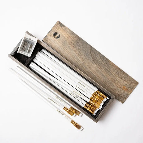 The Blackwing Rustic Box features your choice of 12 premium Blackwing graphite pencils and our reliable Two-Step Long Point Sharpener. Choose from 12 Matte pencils,12 602 pencils, 12 Pearl pencils, 12 Natural pencils, or 3 of each. The aged pine pencil box slides open to reveal the Blackwing pencils and a black cork-lined interior. The smooth stationery box is perfect for any workspace, office, or desk.

All Rustic Boxes now come with our Grey Two-Step Long Point Sharpener.

All Blackwing pencil products co