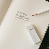 We took the iconic design of our eraser clip and adapted it into a sleek handheld form that feels great to use.

The eraser is made of a special soft material that erases the dark lines of our graphite cleanly and easily. The holder is made of durable aluminum that lets you get a solid grip while erasing. It also includes a jumbo-sized version of the iconic Blackwing clip, so you can extend the eraser as you use it.