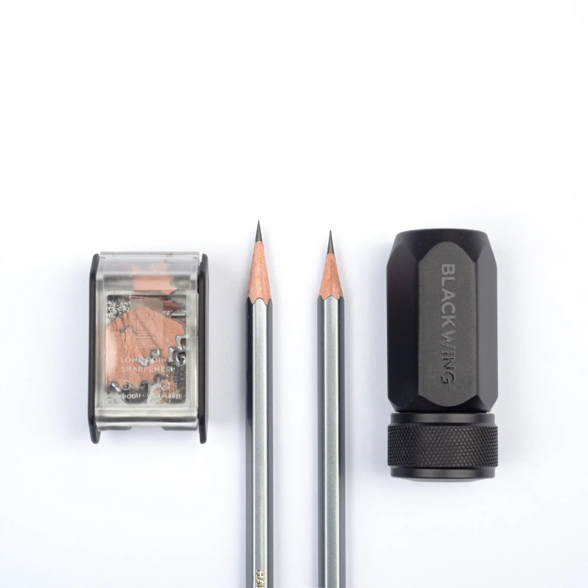 The Blackwing Two-Step Long Point Sharpener creates a sturdy pencil point using a two-step sharpening process. The first hole sharpens the wood, and the second hole precisely sharpens the graphite core, resulting in a strong, sharp point that resists breakage.