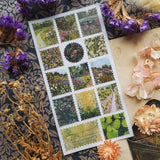 🌼🌷 Stop and smell the flowers in @denaisx’s radiant garden, where every corner bursts with color and life. From golden fields of daisies to secret garden walkways framed in pink blooms, this sheet is filled with nature at its most joyful and abundant. Romantic, vibrant, and endlessly wander-worthy, these stickers will bring the magic of a garden in full bloom straight to your pages.

Art by: @denaisx

Top Coating: None
Adhesive Layer: PVC (plastic)
Backing Layer: Clear PET
6.69" x 3.54".
Weight - 0.03lbs.