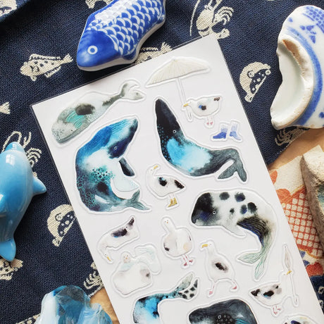 🐋☂️ Breezy and full of seaside charm, @martyna.czub’s watercolor whales and gulls make quite the charming coastal crew. With curious expressions, tiny umbrellas, rain boots, and a few delightfully dramatic whale poses, this playful sheet perfectly captures the magic of a windswept day by the sea.

Art by: @martyna.czub