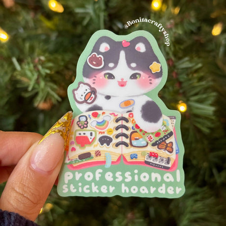 This Professional Sticker Hoarder matte sticker features an adorable kawaii cat surrounded by tiny stickers, perfect for anyone who loves collecting stickers just as much as using them. 🐾📒

♡ STICKER DETAILS ♡
~ Sticker size: 2.3’’ inches
~ Printed on matte sticker paper
~ Matte Laminate finish ✨
~ Scratch-resistant surface, water-resistant
~ ONLY Handwash. This sticker is not dishwasher or microwave safe.