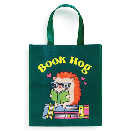 Oink-redibly cute and practical! Our Book Hog Reusable Shopping Bag is the perfect piggy companion for your shopping adventures. This adorable book-loving hog design turns errands into fun while helping you ditch single-use bags. Sturdy enough for groceries, books, or beach essentials, it folds up small when not in use. Shop sustainably with this playful porker that's always ready to carry your treasures!