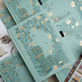 A love letter to book lovers, the Books of Beauty Reading Notebook is designed for cozy reading moments and thoughtful reflection.

Featuring a soft vegan leather cover in a dreamy seafoam hue, delicate gold-foil accents, and an elegant interior end page pattern, this notebook is as beautiful as it is functional—perfect for reading logs, book reviews, TBR lists, and journaling your favorite quotes.

A timeless addition to any stationery or bookish collection—ideal for readers, writers, and journal lovers.