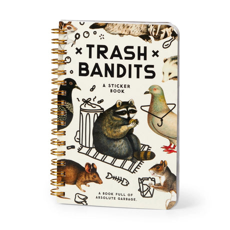 Dumpster chic meets unapologetic attitude in the Trash Bandits Sticker Book—a gloriously messy collection of oversized stickers featuring raccoons, possums, pigeons, and other urban icons with googly eyes and snarky commentary. Whether you're decorating your planner or marking your territory, these critters are here to add some trashy charm to your everyday life.

Inside, you’ll find 18 pages of trash animal stickers + 2 bonus pages of vintage-inspired puffy stickers, all packed with clever quips and chaoti