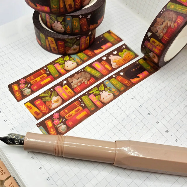 A washi tape inspired by bookish things! This is a reprint of an older design - the colors are a little brighter this time. Each roll of washi tape is 15mm (approximately 0.59 inches) wide and 10 meters (approximately 10.9 yards) long.

Washi tapes have a small labeling sticker with branding and design, but without extra packaging.