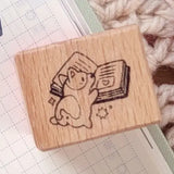 A small wood stamp of a little literary puppy for your planner and scrapbooking needs. Each stamp measures approximately 1 x 0.75 inch.

Stamps come loose and without any extra packaging.
