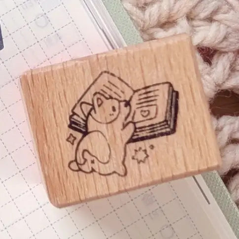 A small wood stamp of a little literary puppy for your planner and scrapbooking needs. Each stamp measures approximately 1 x 0.75 inch.

Stamps come loose and without any extra packaging.