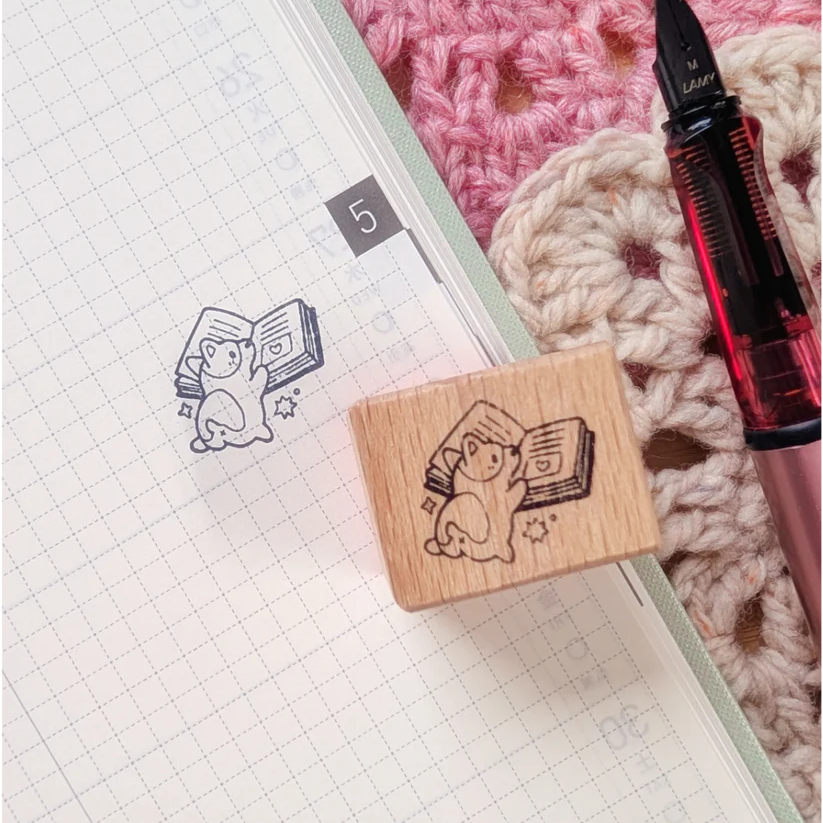 A small wood stamp of a little literary puppy for your planner and scrapbooking needs. Each stamp measures approximately 1 x 0.75 inch.

Stamps come loose and without any extra packaging.
