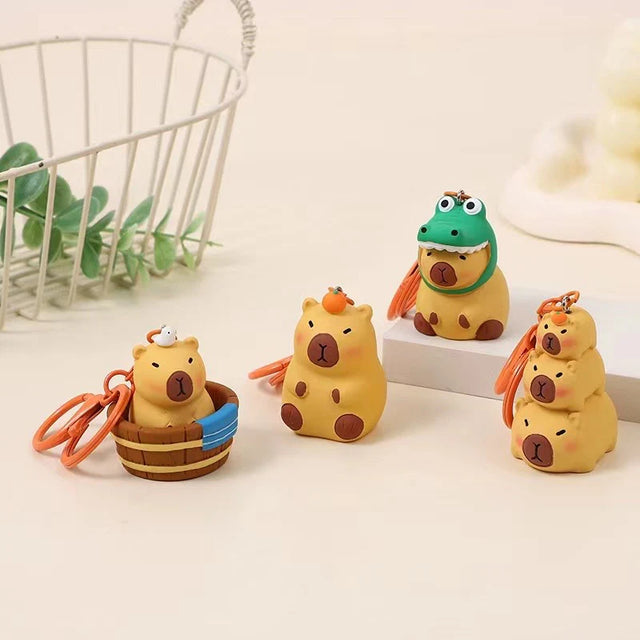 This adorable keychain adds personality wherever you go, whether clipped to your keys, bag, or backpack. Cute, lightweight, and easy to gift, it’s perfect for anyone who loves whimsical accessories or capybara-themed goodies.&nbsp;

Approx 2in x 2in
Includes 1 keychain&nbsp;