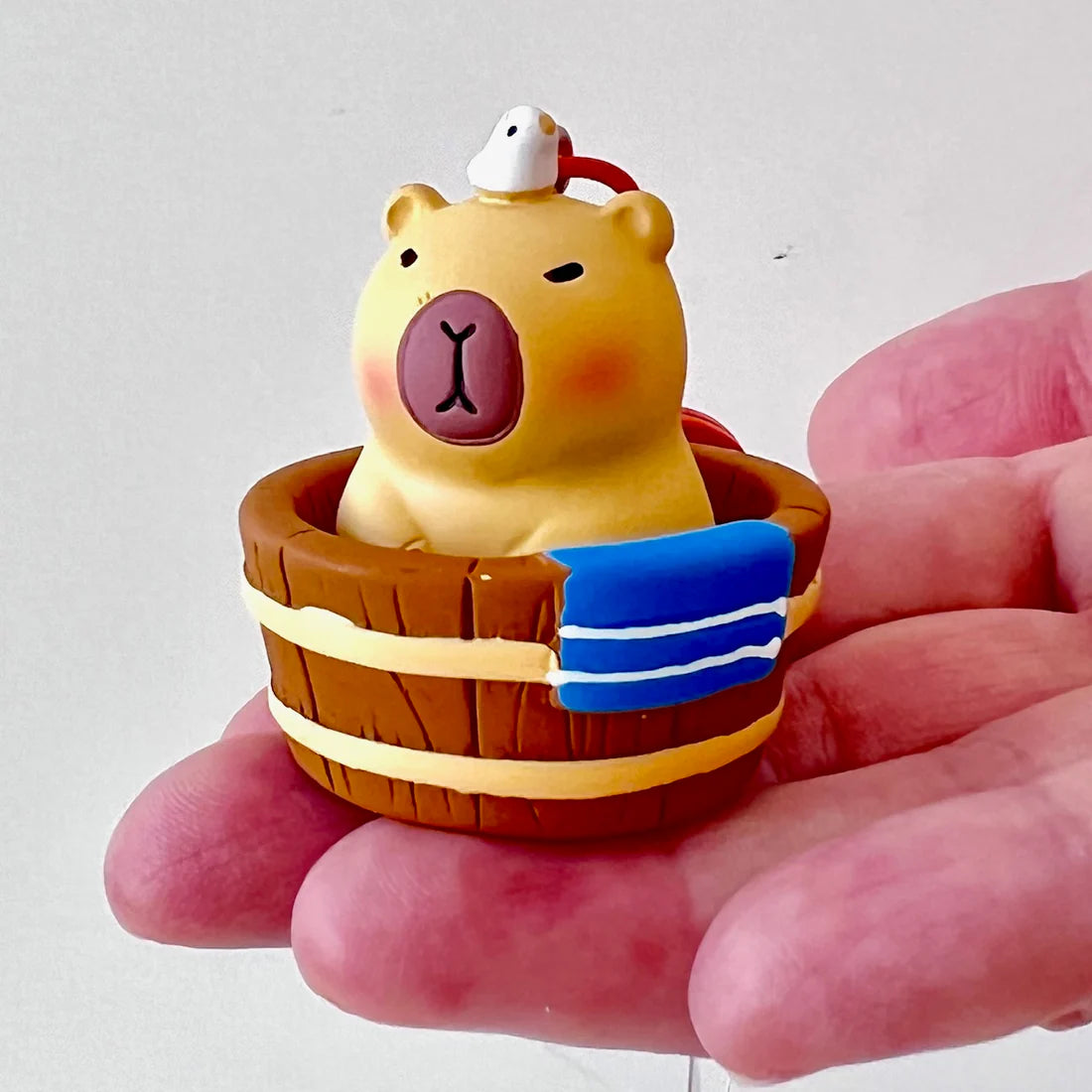 This adorable keychain adds personality wherever you go, whether clipped to your keys, bag, or backpack. Cute, lightweight, and easy to gift, it’s perfect for anyone who loves whimsical accessories or capybara-themed goodies.&nbsp;

Approx 2in x 2in
Includes 1 keychain&nbsp;