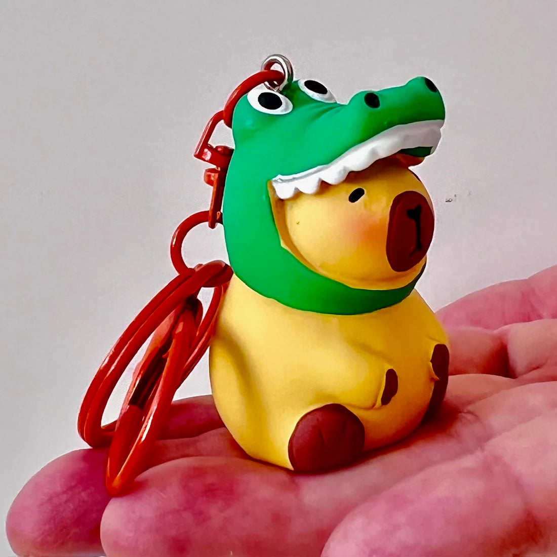 This adorable keychain adds personality wherever you go, whether clipped to your keys, bag, or backpack. Cute, lightweight, and easy to gift, it’s perfect for anyone who loves whimsical accessories or capybara-themed goodies.&nbsp;

Approx 2in x 2in
Includes 1 keychain&nbsp;