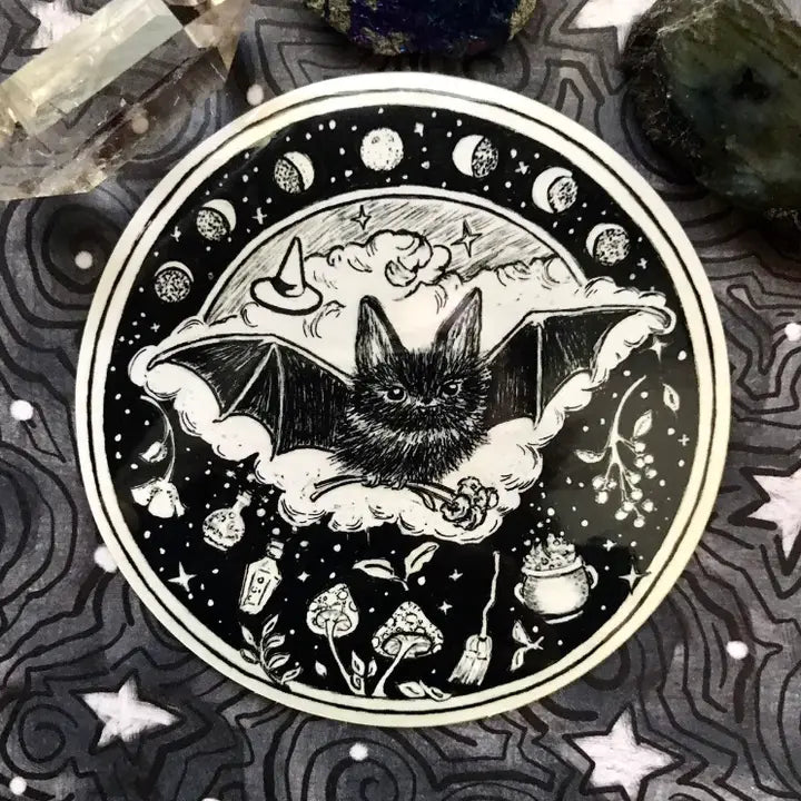 Follow the phases of the moon with a little bat to guide your path!

Includes 1 vinyl sticker
Dimensions: 4"
Dishwasher Safe and Water resistant
Perfect for water bottles, laptops, folders and more!