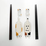 This adorable box set includes 2 sets of chopsticks, rests, and sauce dishes.

Size: Chopsticks 9 inch, Cat Sauce Dish 4 inch L
Material: Bamboo and Ceramic
Origin: China
