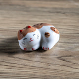 Porcelain brown cat chopstick rest / pen rest.
