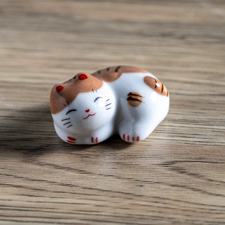 Porcelain brown cat chopstick rest / pen rest.