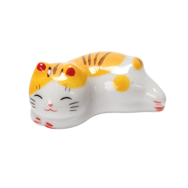 Porcelain yellow cat chopstick rest / pen rest.