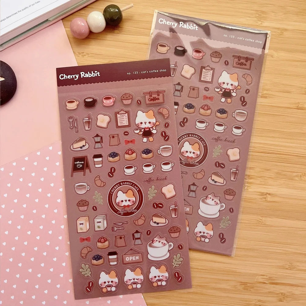 Clear transparent stickers! Decorate your planner / diary with these little stickers of a cat’s coffee shop ☕🐈✨

Kiss cut sticker sheet
1 sheet
Sheet size: 9 x 18 cm
Material: Clear PET