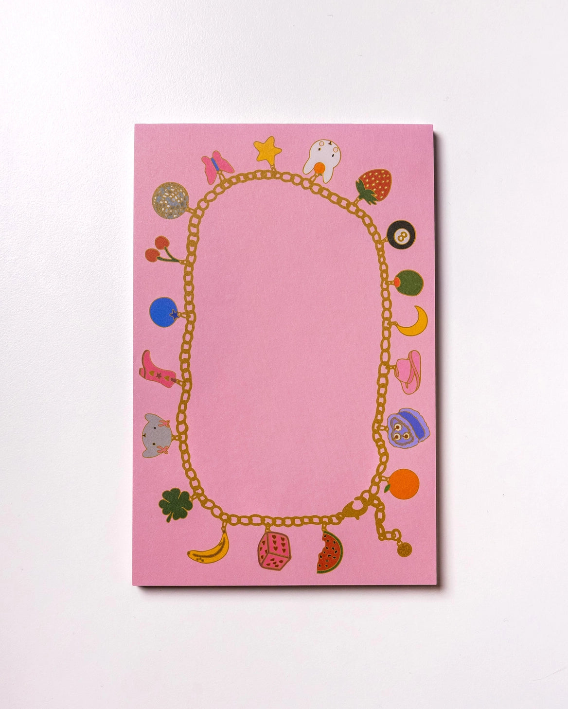 Charmed By Clem Notepad by Clem & Co.

Clem the Bun loves to make charm bracelets for all her friends! However, she kept forgetting which of her friends she had already given them to, so she made a notepad to keep track. Jot down things you don't want to forget either on this charming little notepad!