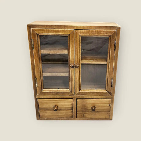 These wooden cabinets will add a beautiful decorative touch to your desk or creative space. They are also highly functional, with two drawers, and shelves of different heights. This product is handmade and an exclusive design of CoraCreaCrafts.

Important Note: This product includes the wooden cabinet only. Any decorative items on the inside are for display purposes only.

Size: 20 x 25 x 7.5cm