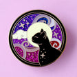 This amazing Cosmic Cat features a black cat against a celestial background, done in an Art Nouveau style. The purple and blue swirls are full of glitter – this fab pin is a real conversation starter!&nbsp;

The pin is secured by two purple heart backs and comes on a special ‘Art Nouveau’ Glitter Punk backing card, making it perfect for a gift or to keep as a special treat for yourself.

This pin is part of my Art Nouveau Cats collection – 8 enamel pins based on the fabulous 19th/20th century art movement.
