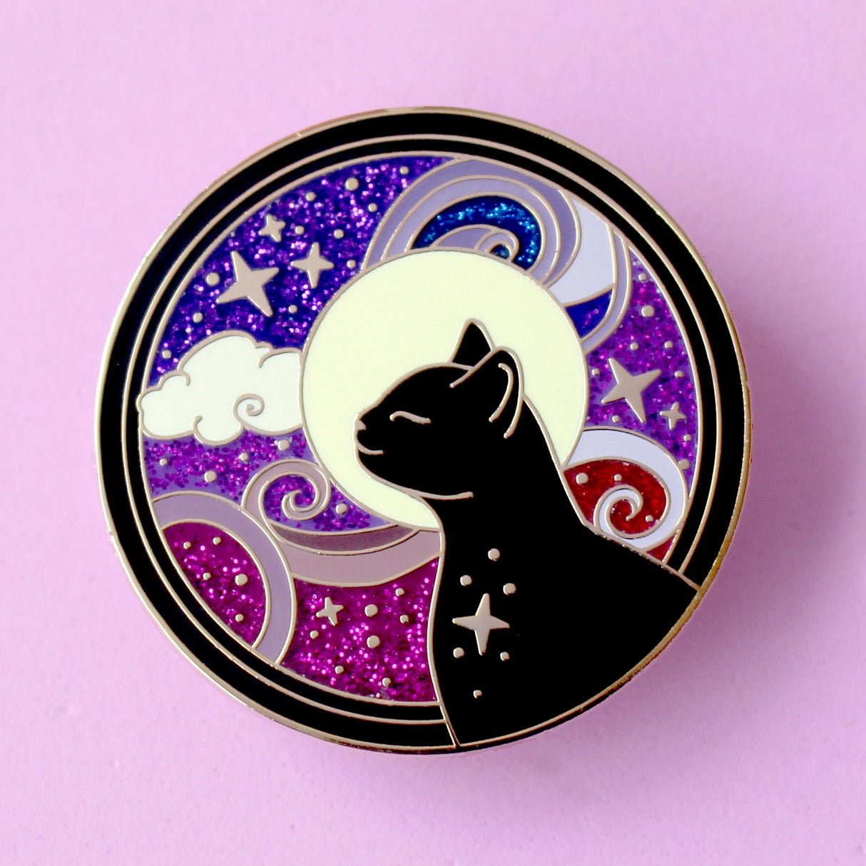 This amazing Cosmic Cat features a black cat against a celestial background, done in an Art Nouveau style. The purple and blue swirls are full of glitter – this fab pin is a real conversation starter!&nbsp;

The pin is secured by two purple heart backs and comes on a special ‘Art Nouveau’ Glitter Punk backing card, making it perfect for a gift or to keep as a special treat for yourself.

This pin is part of my Art Nouveau Cats collection – 8 enamel pins based on the fabulous 19th/20th century art movement.
