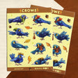 A bunch of crows with various accessories. Some backpacks, scarves and hats! 8 Total large stickers, and 6 smaller stickers.

Waterproof vinyl sticker sheet, 5"x7"
14 peelable stickers per sheet
Durable and high quality
Packaged in a clear plastic sleeve