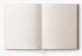 Our embroidered sketchbook is a large, hardcover journal with 108 unlined pages of thick paper perfect for sketching, drawing, and journaling. The cover is wrapped in cream book cloth and embroidered with the beetles and bugs of our Curio print with metallic gold accents. An attached grosgrain ribbon bookmark will save your place.