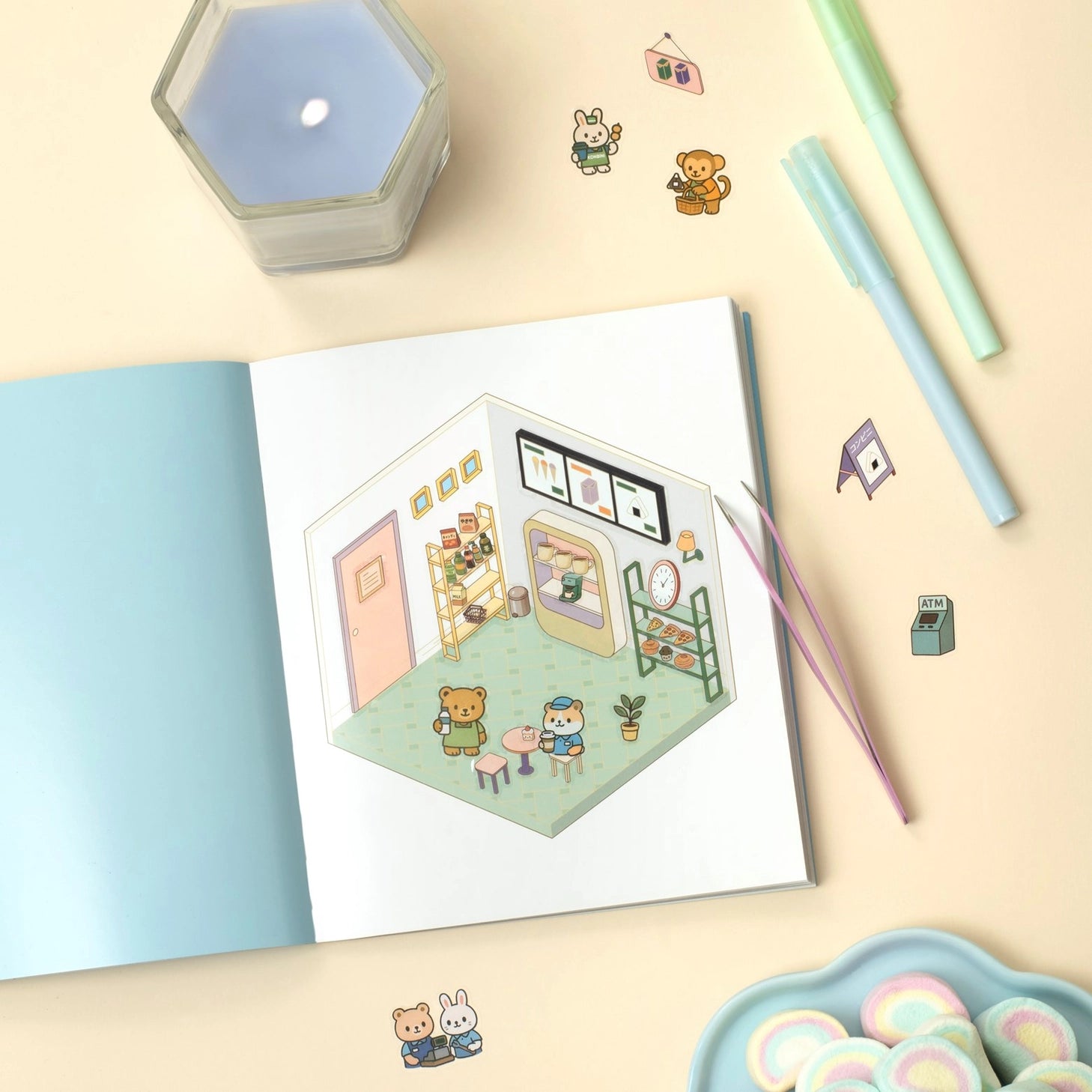 Create the coziest "konbini" convenience store imaginable, with six room sets and hundreds of stickers…

Welcome to a cozy world of absolute cuteness! Pick an empty space; furnish it, decorate it and fill it with furry little characters until it's a busy little convenience store. Then carry on until you've created your own unique keepsake: there are six to complete in this book!