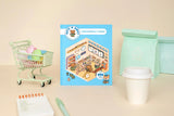 Create the coziest "konbini" convenience store imaginable, with six room sets and hundreds of stickers…

Welcome to a cozy world of absolute cuteness! Pick an empty space; furnish it, decorate it and fill it with furry little characters until it's a busy little convenience store. Then carry on until you've created your own unique keepsake: there are six to complete in this book!