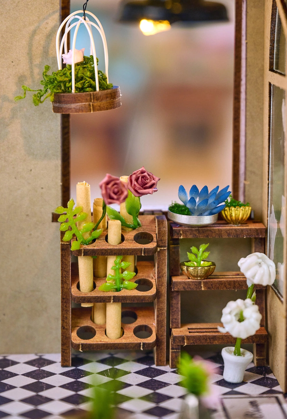 Step inside The Flower Shop, a cozy miniature haven where vibrant flower arrangements bloom in elegant vases, lush potted plants thrive, and fresh bouquets overflow with color. This delightful build features classic red brick walls, a welcoming wooden arched doorway, and a checkerboard floor that adds timeless charm.

2 AAA batteries required; batteries are not included.
Ages 14+
248 pieces
Assembled size: 4.53 x 3.94 x 7.4 inches