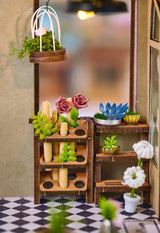 Step inside The Flower Shop, a cozy miniature haven where vibrant flower arrangements bloom in elegant vases, lush potted plants thrive, and fresh bouquets overflow with color. This delightful build features classic red brick walls, a welcoming wooden arched doorway, and a checkerboard floor that adds timeless charm.

2 AAA batteries required; batteries are not included.
Ages 14+
248 pieces
Assembled size: 4.53 x 3.94 x 7.4 inches