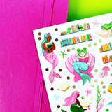 PipStickers are the PERFECT gift for the sticker lover in your life - even if it's you! These unique PVC designs with silver foil accents come on a clear backing and cannot be found anywhere else.

Includes one 4" x 4" sheet of Deep Sea Reads PipStickers and includes the Pipsticks manifesto.