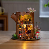 Bring a touch of storybook charm to your shelves with the Fairytale Tree House DIY Miniature Kit — a cozy two-story tree-trunk home filled with whimsical details, plants, and tiny décor. A relaxing build and a beautiful display piece for miniature lovers.

2 AAA batteries required; batteries are not included.
Ages 14+
275 pieces&nbsp;
Assembled size: 8.3 x 7.2 x 8.9 inches
