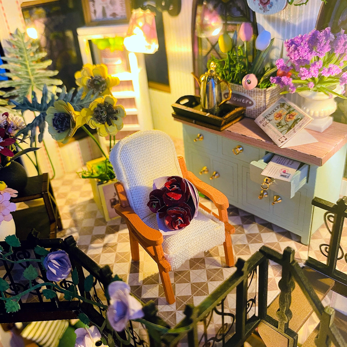 Escape into a peaceful retreat with this miniature kit-a dreamy blend of indoor charm and outdoor beauty. This cozy loft is a plant lover's paradise, filled with blooming flowers, lush greenery, and thoughtful touches of home. With a comfy sofa, a charming desk, and warm light that illuminates the space, it's the perfect hideaway for creativity and relaxation.

2 AAA batteries required; batteries are not included.
Age Range: 14+
Assembled Dimensions: 8.7 x 6.7 x 9.25 inches