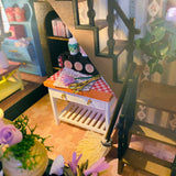 Escape into a peaceful retreat with this miniature kit-a dreamy blend of indoor charm and outdoor beauty. This cozy loft is a plant lover's paradise, filled with blooming flowers, lush greenery, and thoughtful touches of home. With a comfy sofa, a charming desk, and warm light that illuminates the space, it's the perfect hideaway for creativity and relaxation.

2 AAA batteries required; batteries are not included.
Age Range: 14+
Assembled Dimensions: 8.7 x 6.7 x 9.25 inches