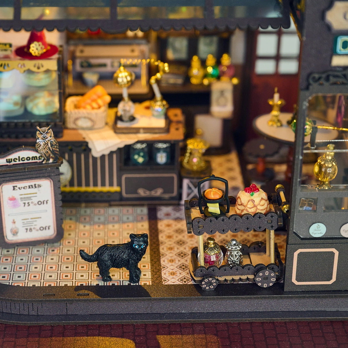 Step into a whimsical world of sugar, spells, and stardust with the Magic Café DIY Miniature House Kit. This enchanting build-it-yourself café brings to life a cozy little corner where witches, wizards, and woodland creatures gather for enchanted brews and magically infused pastries. Watch as tiny shelves fill with jars of mysterious ingredients, and the glass display case glows with cakes that sparkle with edible enchantments.

2 AAA batteries required; batteries are not included.
Ages 14+ 380 pieces
Assem