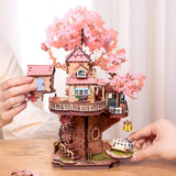 Craft a fairy sakura-scented retreat with this Rolife 3d puzzle! Delicate cherry blossoms, a swing, spiral stairs &amp; lift basket channel —no plastic, just soul-soothing wood. The miniature kit brings adventure fantasies to life.

535-piece 3d puzzle click snugly without glue—just gentle pressure! (no nail-breaking snaps!). Enjoy 5 hours of immersive, stress-relieving fun with the miniature kit. Perfect for unwinding after work or sharing quality time with family.