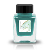 Phosphophyllite, from Tono &amp; Lims’ Earth Contact Series, captures the radiant brilliance of the rare gemstone in ink form. Inspired by birthstones, this shimmering fountain pen ink contains fine glitter particles. Perfect for those who love bold and luminous colors, Phosphophyllite transforms each stroke into a sparkling display of depth and light. Be sure to shake the bottle well before use to evenly disperse the glitter.