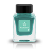 Phosphophyllite, from Tono &amp; Lims’ Earth Contact Series, captures the radiant brilliance of the rare gemstone in ink form. Inspired by birthstones, this shimmering fountain pen ink contains fine glitter particles. Perfect for those who love bold and luminous colors, Phosphophyllite transforms each stroke into a sparkling display of depth and light. Be sure to shake the bottle well before use to evenly disperse the glitter.