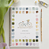 Twelve spring illustrations — a bunny, baby chick, tulips, lilacs, an Easter basket, a bicycle with flowers, and more — each pre-outlined with step-by-step instructions. Paintings take about thirty minutes from start to finish, making it approachable for first-time painters and a favorite for gifting.

Enjoy this peaceful painting hobby on your own, with children, or with friends. Makes a wonderful gift and is perfect for artists of any age.
Details:

12 beginner-friendly illustrations
Thick 120lb watercolo