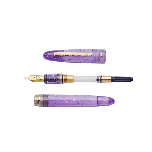 Esterbrook x Sakuradragon Sakura Street Estie Fountain Pen

Created with artist Cindy Duong of Sakuradragon, the Sakura Street Estie brings her imaginative illustrated world to Esterbrook's traditional Estie fountain pen. Its U.S.-blended material combines translucent purple with colorful glitter sparkle, while the custom clip is etched with Cindy's Sakura pattern. Dual Esterbrook and Sakuradragon engraving and a gold-plated converter finish the design. Each pen arrives in special packaging with Japanese gi