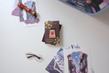 The Sakura Street Ink Lapel Pin turns one of the collection's coordinating ink bottles into a collectible hard enamel design. Measuring 4.5 cm and finished with gold-plated details, the pin carries the colors and imagination of Cindy Duong's Sakura Street artwork onto a jacket, bag, or display board.