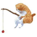These figures are of cats sitting on a fishing line. They are sitting on the fishing line, looking at the line and relaxing.

Lineup (5 Variants):

Scottish Fold
Calico Cat
Norwegian Forest Cat
Munchkin
Mix