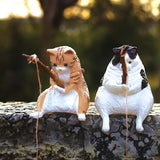 These figures are of cats sitting on a fishing line. They are sitting on the fishing line, looking at the line and relaxing.

Lineup (5 Variants):

Scottish Fold
Calico Cat
Norwegian Forest Cat
Munchkin
Mix
