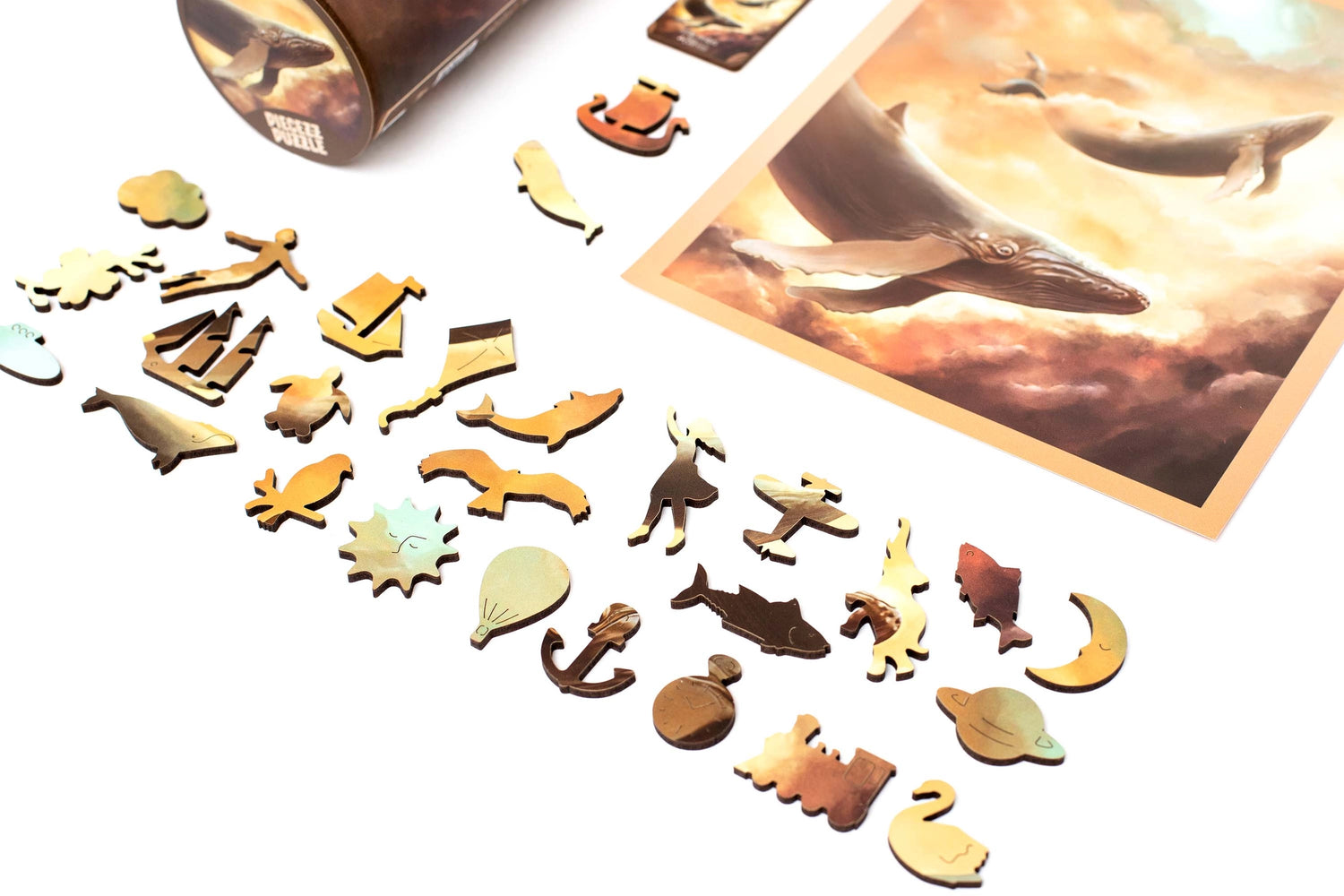 Embark on a whimsical adventure through the skies with our Flying Whales Piecezz Wooden Puzzle. This captivating wooden puzzle invites both kids and adults to take flight alongside majestic flying whales, offering hours of imaginative and engaging play. Dive into the details of this remarkable animal-shaped puzzle that promises delightful adventures.