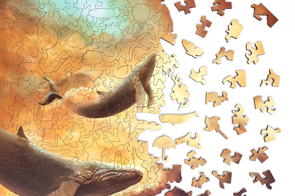 Embark on a whimsical adventure through the skies with our Flying Whales Piecezz Wooden Puzzle. This captivating wooden puzzle invites both kids and adults to take flight alongside majestic flying whales, offering hours of imaginative and engaging play. Dive into the details of this remarkable animal-shaped puzzle that promises delightful adventures.