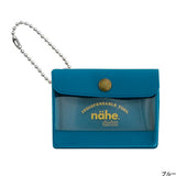 A miniature keychain version of the popular General Purpose Case by nähe. The true-to-original case comes with a clear front pocket with extra inserts inside and out. A ball chain securely attached to the corner of the case lets you hang it onto your keys or bags, perhaps in multiples.

Perfect size to travel with and quickly access your keys, coins, medicine, or small accessories.&nbsp;