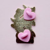 We’ve all sometimes wished we were at home with a hood book, rather than having to deal with the real world! This super cute pin features a black cat sitting on pink &amp; purple books with the slogan ‘I’d rather be reading’. Behind the cat is a large crescent moon and a pair of glittery pastel clouds.

Measurements: 45mm (1.77”)