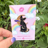 Cute, cuddly and clever – there’s no cat quite like a Sphynx! This fab enamel pin features a black Sphynx covered in mystical symbols, sitting in front of a crescent moon with 2 purple clouds.

The pin is 42mm (1.65”) tall, and is made from gunmetal hard enamel, with glitter and UV printed details. It's secured with 2 pink clutches to keep the pin in place.